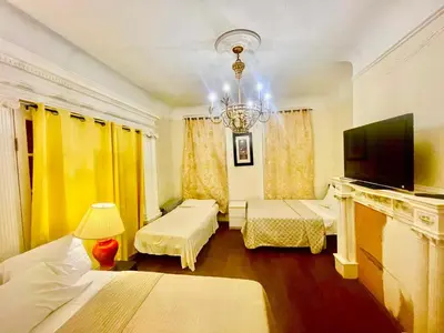 a hotel room with two beds and a television at MOTEL House in Newark