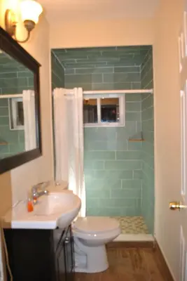 a bathroom with a sink and a toilet and a shower at MOTEL House in Newark