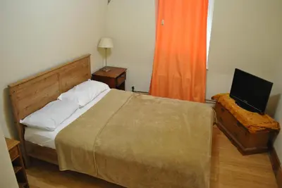 a bedroom with a bed and a television on a table at MOTEL House in Newark