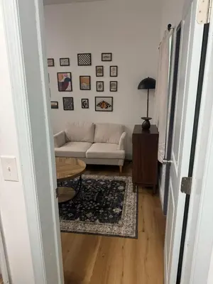 a living room with a couch and a table at Cozy Stay Near Fishtown - Close to Subway & Center City by Globenest in Philadelphia