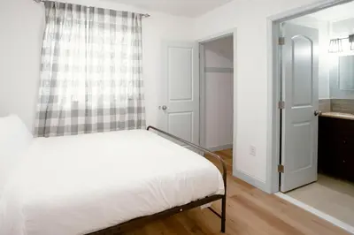 a bedroom with a bed and a window at Cozy Stay Near Fishtown - Close to Subway & Center City by Globenest in Philadelphia