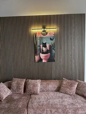 a living room with a couch and a picture of a toilet at Cozy Stay Near Fishtown - Close to Subway & Center City by Globenest in Philadelphia
