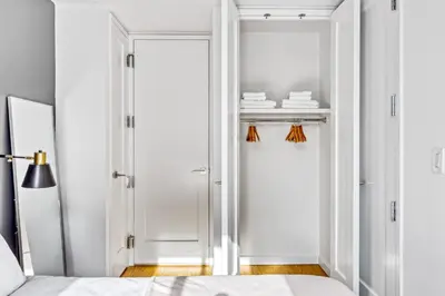 a bedroom with a door leading to a closet at UWS 1br w doorman elevator nr Central Park NYC-372 in New York