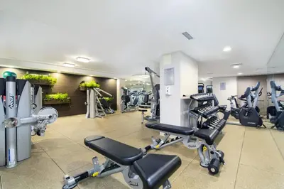 a gym with several treadmills and cardio machines at UWS 1br w doorman elevator nr Central Park NYC-372 in New York
