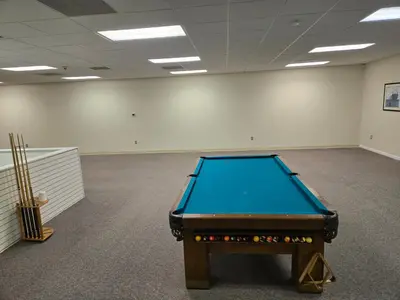 a pool table in the middle of a room at Spooky Nook Bed and Breakfast in Manheim