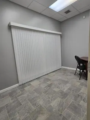 an office room with a white wall and a table at Spooky Nook Bed and Breakfast in Manheim