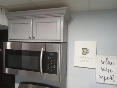 a kitchen with a microwave oven and cabinets at Hidden Gem in Middletown