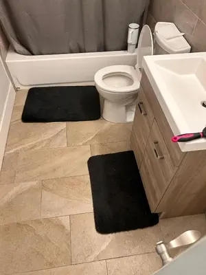 a bathroom with a white toilet and a sink at 18stStays in Philadelphia