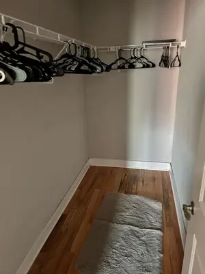 a room with a closet with a wooden floor at 18stStays in Philadelphia