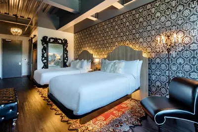 a hotel room with two beds and a mirror at Hotel Nyack, a JdV by Hyatt Hotel in Nyack