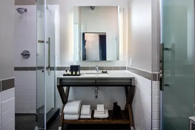 a bathroom with a sink and a mirror at Hotel Nyack, a JdV by Hyatt Hotel in Nyack