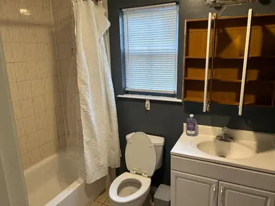 a bathroom with a toilet and a sink at Luxury Townhouse in Newark in Newark