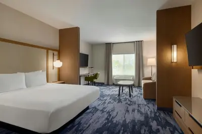 a hotel room with a bed and a desk at Fairfield by Marriott Inn & Suites Lancaster in Lancaster