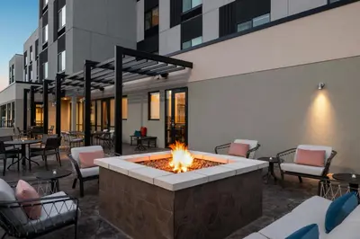 a fire pit in the courtyard of a building at TownePlace Suites by Marriott Lancaster in Lancaster