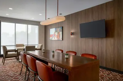 a conference room with a table and chairs and a tv at TownePlace Suites by Marriott Lancaster in Lancaster