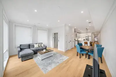 a living room with a couch and a table at Modern Luxury 3BR 2BA 10 minutes to NYC in Weehawken