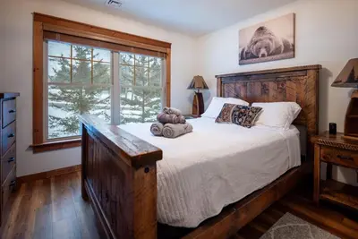a bedroom with a bed with a teddy bear on it at Luxury House in Pocono Mountains in Tannersville