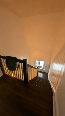 a staircase in a house with a window at Rooftop GreeneHouse Suite in Philadelphia