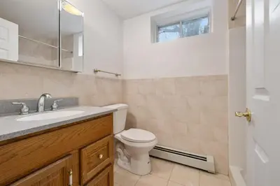 a bathroom with a toilet and a sink and a mirror at Secluded 9BR Getaway, Pool, Hot Tub & Huge Deck in Chester
