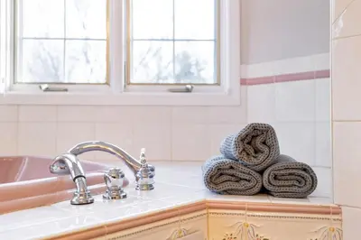 a kitchen counter with a sink and towels at Secluded 9BR Getaway, Pool, Hot Tub & Huge Deck in Chester