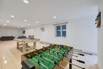 a living room with a pool table and a table at Secluded 9BR Getaway, Pool, Hot Tub & Huge Deck in Chester