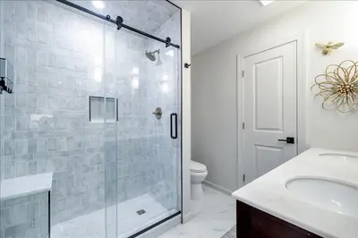 a bathroom with a shower and a sink and a toilet at Luxury Hot Tub Sauna Game Room Dog Friendly in Albrightsville