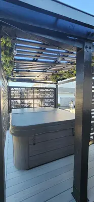 an outdoor deck with a table and a bench at Staycation Oasis! a unique Experience! Heated pool open until November 1st in Easton