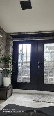 a black door with a potted plant in front of it at Staycation Oasis! a unique Experience! Heated pool open until November 1st in Easton