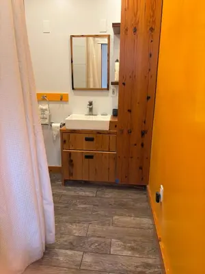 a bathroom with a sink and a mirror at Roscoe Pine House in Roscoe
