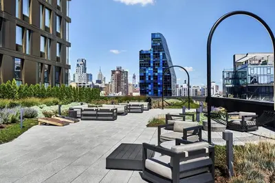 a group of benches on a sidewalk in a city at Blueground LES gym doorman near market NYC-1523 in New York