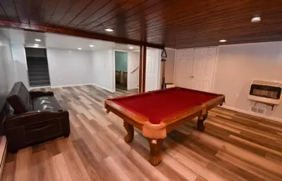 a pool table in the middle of a room at Cozy home away from home in Tobyhanna