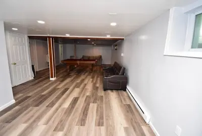 a living room with a couch and a table at Cozy home away from home in Tobyhanna