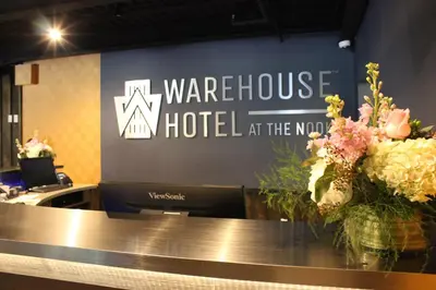a sign for a warriott hotel at the nova at Warehouse Hotel at The Nook in Manheim
