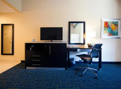 a room with a desk with a computer and a chair at Warehouse Hotel at The Nook in Manheim