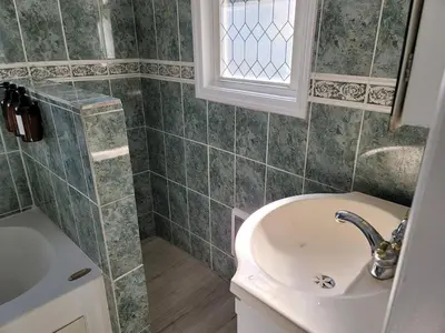 a bathroom with a sink and a window at Two-Bedroom Home 25 min to NYC Free parking-UNIT-1 in Teaneck