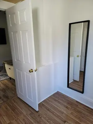 a white door with a mirror in a room at Two-Bedroom Home 25 min to NYC Free parking-UNIT-1 in Teaneck