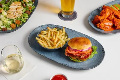 a plate of food with a sandwich and french fries at Hyatt Place Secaucus Meadowlands in Secaucus