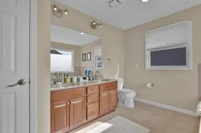 a bathroom with a sink and a toilet at Oceanfront Villa - Panoramic NYC Views - Luxury Home in Keansburg