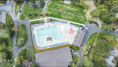 an overhead view of a swimming pool in a yard at Whimsical Wilderness Lodge in Tobyhanna