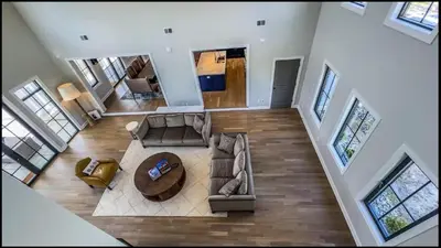 an overhead view of a living room with a couch and a table at Modern Farm Estate Close To Six Flags & Vineyard in Cream Ridge