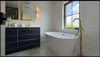 a bathroom with a tub and a sink and a window at Modern Farm Estate Close To Six Flags & Vineyard in Cream Ridge