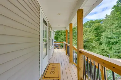 a porch of a house with a sign on it at Hudson Valley Retreat with Pool Near Greenwood Lake in Monroe
