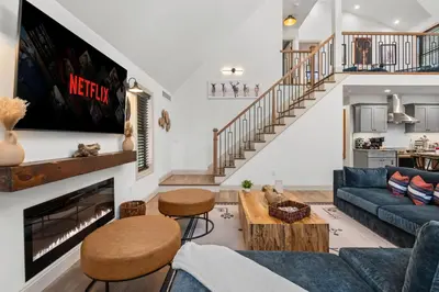 a living room with a couch and a fireplace at Luxury Getaway with Nature and Comfort in Albrightsville
