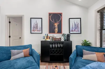 a living room with two blue couches at Luxury Getaway with Nature and Comfort in Albrightsville