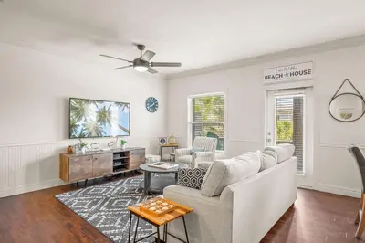 a living room with a couch and a table at Casa Del Mar - GOLF CART INCLUDED in Philadelphia