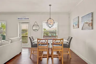 a dining room with a table and chairs at Casa Del Mar - GOLF CART INCLUDED in Philadelphia