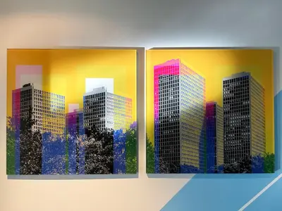 two paintings of buildings on a wall at Gallery Suite in Art Tower in Philadelphia