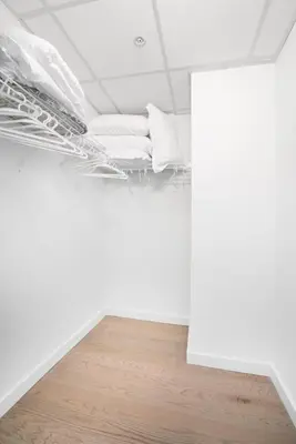 a room with two beds on the ceiling at Midtown View - Minutes to City in Hoboken