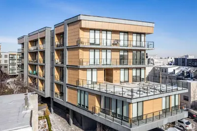 an apartment building with balconies in a city at Courtyard Studio - Serene Space Gym Wi-Fi in Philadelphia