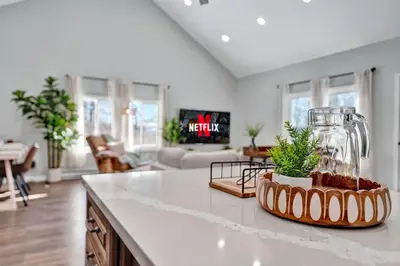 a kitchen counter with a vase and plants on it at Palomino Ranch namaste-sunroom, hot tub, game room, king beds, fire pit, BBQ, pet-friendly in Tobyhanna